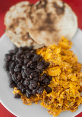 Mexican scrambled eggs with beans and tortillas