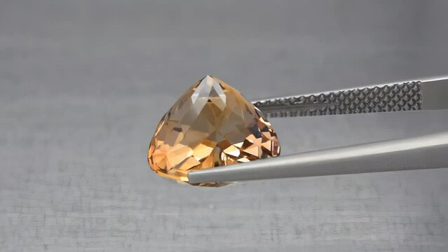 imperial champagne yellow topaz heart cut in the turning tweezers