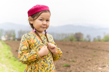 girl in a national headdress. Spring, Nowruz holiday. Kazakh girl. Central Asia, Kazakhstan.