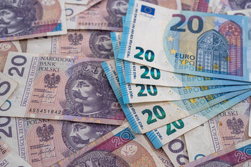 heap pile of euro bills with polish zloty as finance background