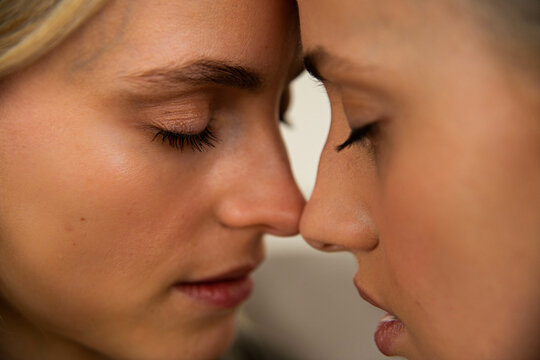 Close up of a lesbian couple embracing.