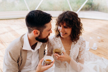 Tea ceremony at a boho wedding. Bride and groom in boho.