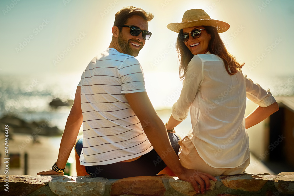 Poster were not ready to go home yet. shot of a happy young couple enjoying a summers day outdoors.