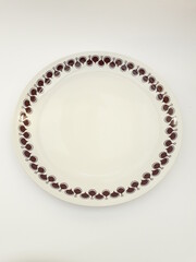 Vintage porcelain plate with chesnut pattern isolated