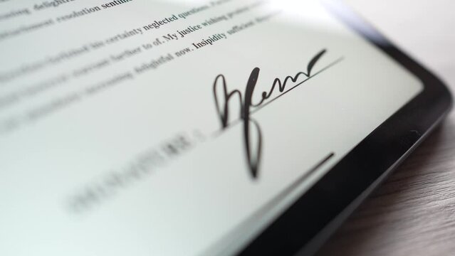 Closeup Macro Shot of a Digital Signature on a Tablet Screen