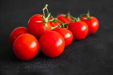 cherry tomatoes tomato on a green branch vegetable fresh healthy meal food snack diet on the table copy space food background rustic top view keto or paleo diet veggie vegan or vegetarian food