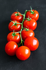 cherry tomatoes tomato on a green branch vegetable fresh healthy meal food snack diet on the table copy space food background rustic top view keto or paleo diet veggie vegan or vegetarian food