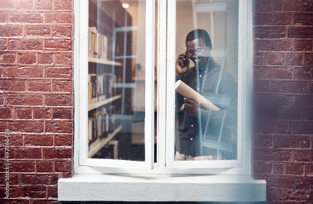 Poster i put in a lot of work on this one. cropped shot of a handsome young male architect taking a phoneca