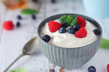 A bowl with Greek yogurt with berries	