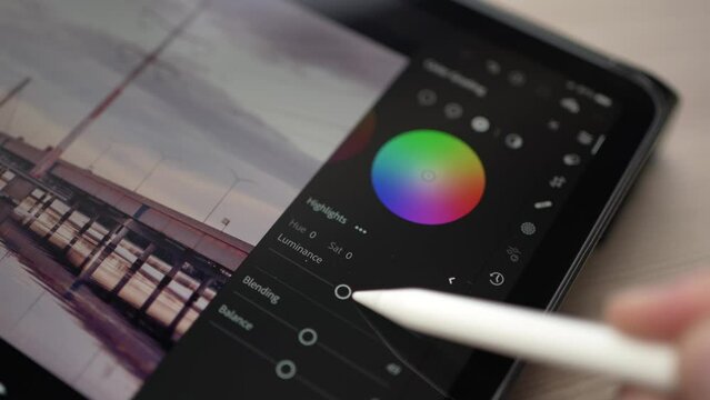 Photo Editing App on a Tablet Screen Adjusting Settings With Stylus