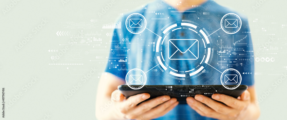 Poster email concept with young man using a tablet computer