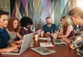 We create, we work hard and we collaborate. Cropped shot of creative colleagues having a meeting in a modern office.