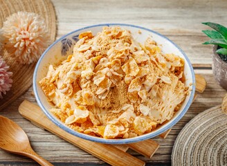 Peanut Noodle Tea Snowflake nimco in a dish side view on wooden table taiwan food