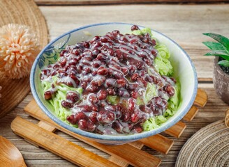 Matcha Red Bean Snowflakes in a dish side view on wooden table taiwan food