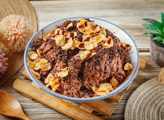 Chocolate Black Forest cake in a dish side view on wooden table taiwan food