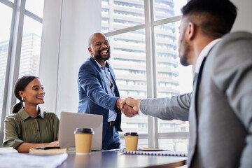 Are you ready to get started. Shot of two business people shaking hands during a meeting. - Powered by Adobe