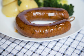Alheira, a typical Portuguese dish made from pork accompanied by broccoli and boiled potatoes drizzled in olive oil. Typical meal and much appreciated in the coldest season of the year.