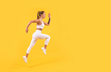 Fototapeta na wymiar sport girl runner running on yellow background with copy space