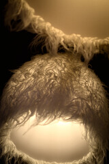 Ceiling lamps in the form of white Caucasian woolen hats. Papakha is a Georgian hat converted into a ceiling lamp.