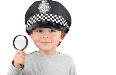 Boy with magnifying glass in hand on white background. Investigation concept