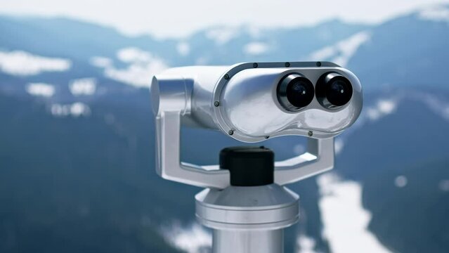Viewing binoculars on a peak in the winter Carpathians, Romania