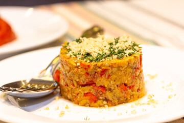 Rice with red pepper and vegetables is on a plate