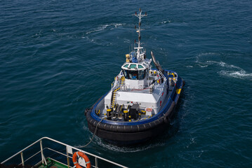 Tugboat during mooring operation at sea