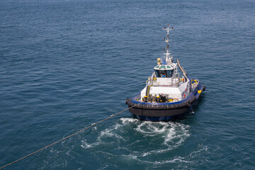 Tugboat during mooring operation at sea