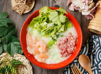 Shrimp Lean Meat Porridge in a bowl top view on wooden table taiwan food