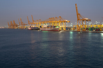 Container terminal in port at night