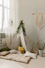 Spring children's photo zone with a wigwam. Children's interior.  © Антон Романюк