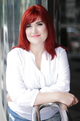 Red hair woman urbn portrait, white shirt