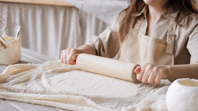 Handcraft woman master modeling cold porcelain, hands with rolling pin, creative workshop, Girl sculpts from porcelain, hobby for the soul scandinavian and boho style interior decor
