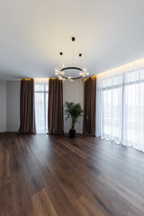 Vertical photo of Interior design spacious bright studio apartment in Scandinavian style and warm pastel white and beige colors. trendy furniture in the living area,