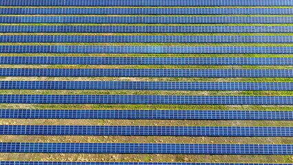 Solar power stations. Blue solar power plant modules close up. Alternative renewable clean green power. Environment ecology energy. Nature generation electric technology. Eco electricity background.