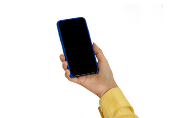 The hand holds a mobile phone with a blank screen highlighted on a white background. Panorama with empty space