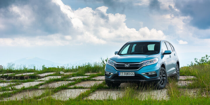 perechyn, ukraine - JUN 22, 2019: blue honda cr-v in mountains. cloudy weather in summer. travel by car concept