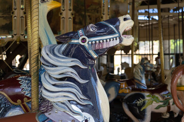 Detail of the head of a blue purple carousel horse
