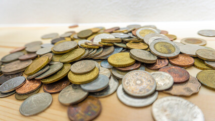 World coins piled up on the table_06