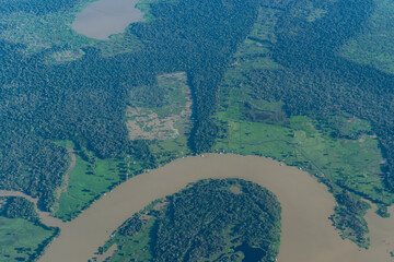 Aerial view of an area of the amazon rainforest in Brazil, showing vegetation, river and some human...