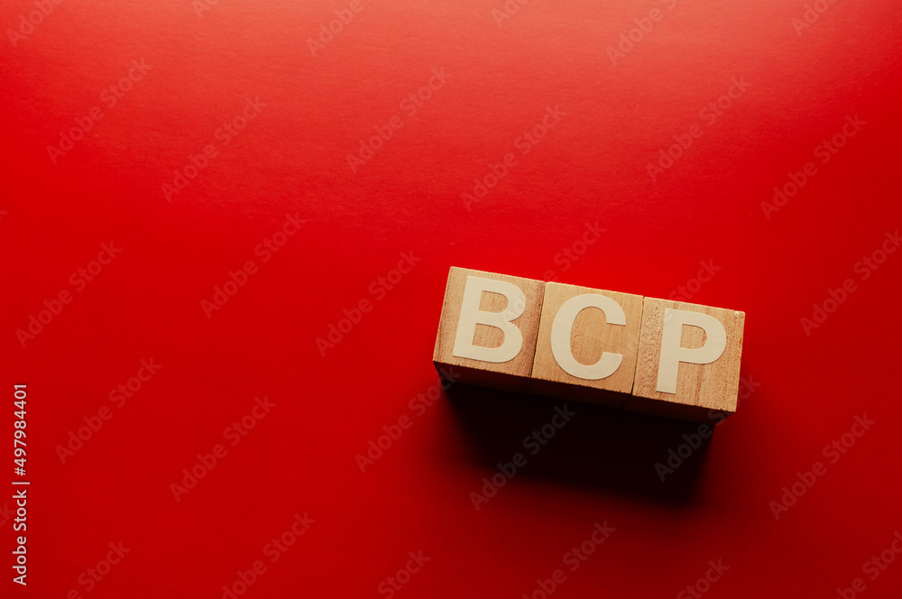 Aufkleber there is word cube formed the word bcp. it's placed on a colored board. copy space available.
