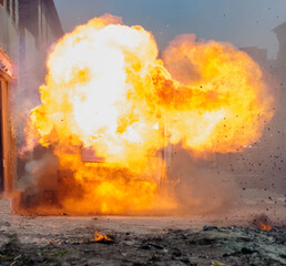 real explosion with fire smoke and dust in the street without people