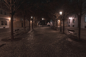 glowing lantern from street lights on a snowy square