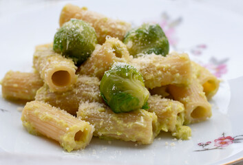 Macaroni with bruxells sprouts sauce, pine nuts and grated lemon peel.