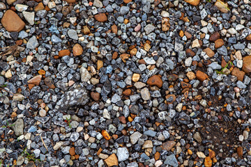 Rocks from a degrading old pavement road