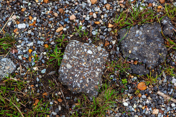 Rocks from a degrading old pavement road