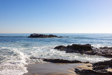 Waves crashing on rocks