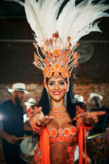 The music is in my soul. Cropped portrait of a beautiful samba dancer performing in a carnival with...