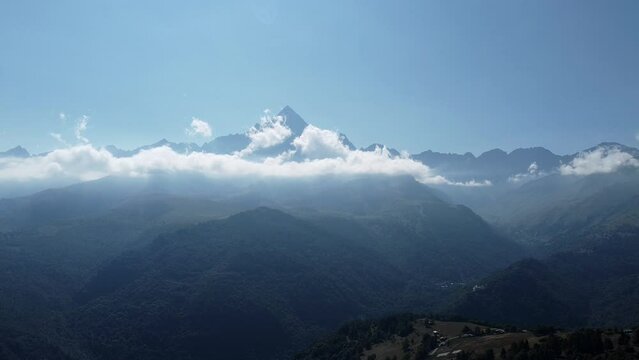 il monviso shrouded in clouds, 4k video of a dji drone, during the summer of 2021