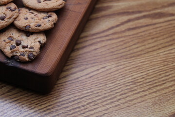 Fototapeta na wymiar Delicious chocolate cookies placed on a wooden table